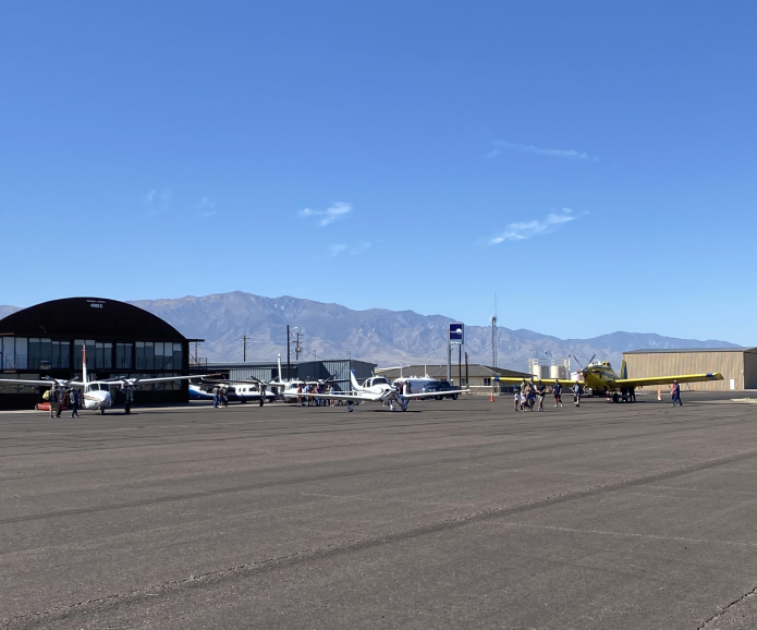 A large airplane is parked on the runway.