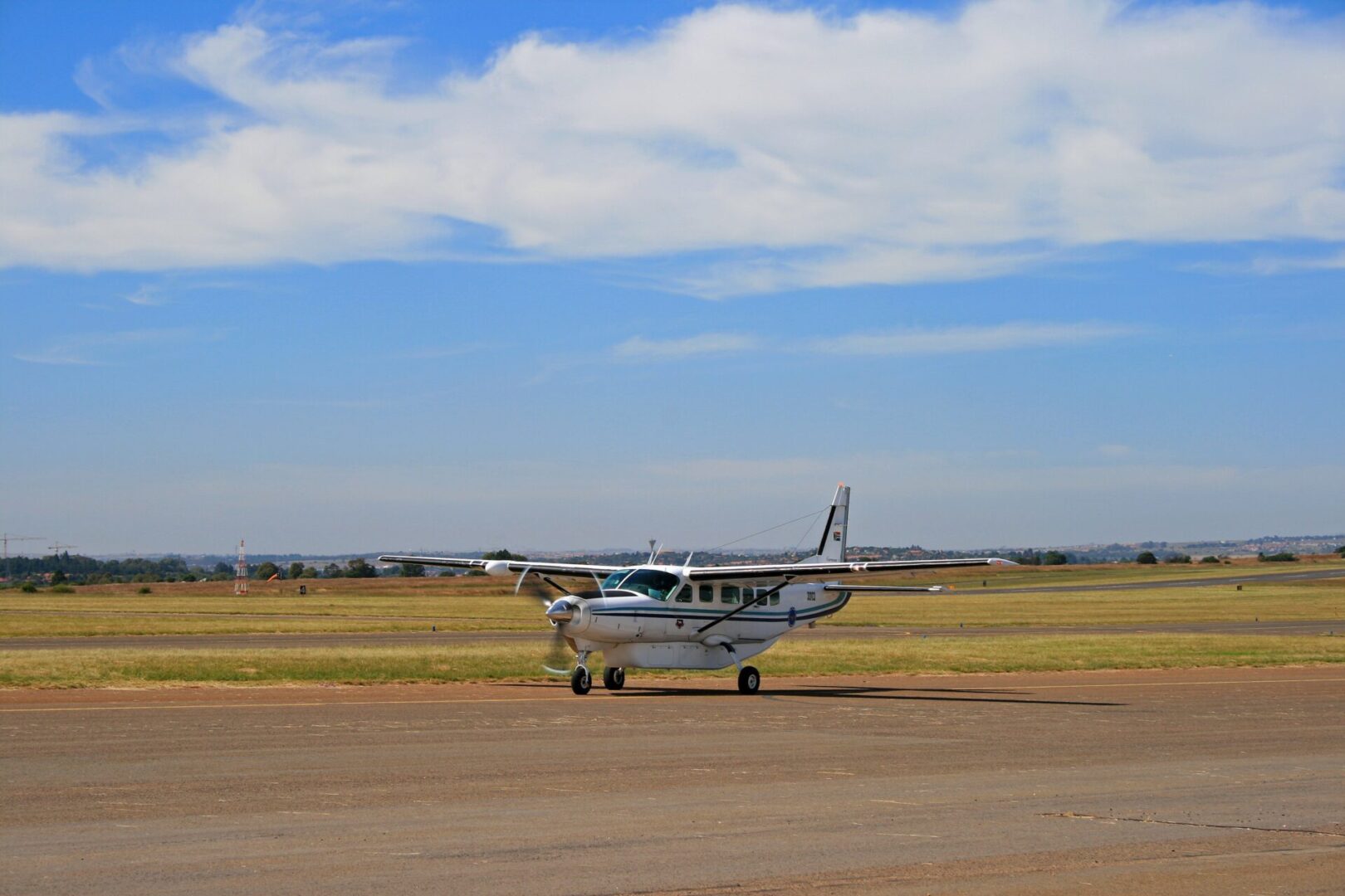 A small plane sitting on top of an airport runway.