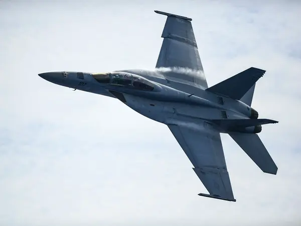 A fighter jet flying through the sky.