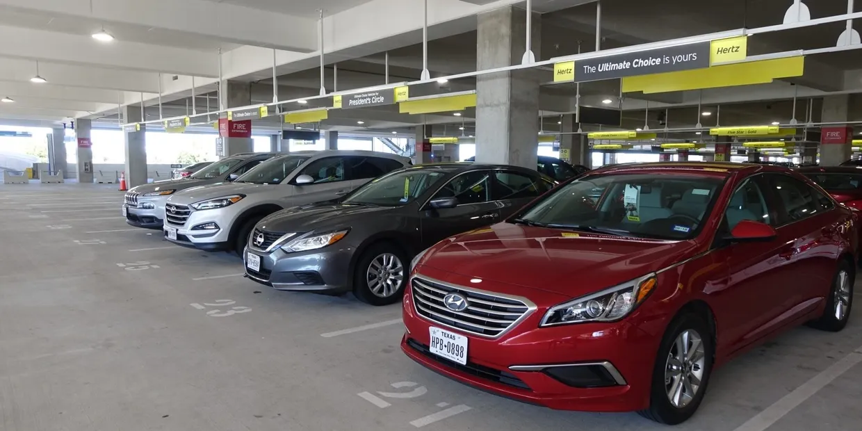 A row of cars in a parking garage.