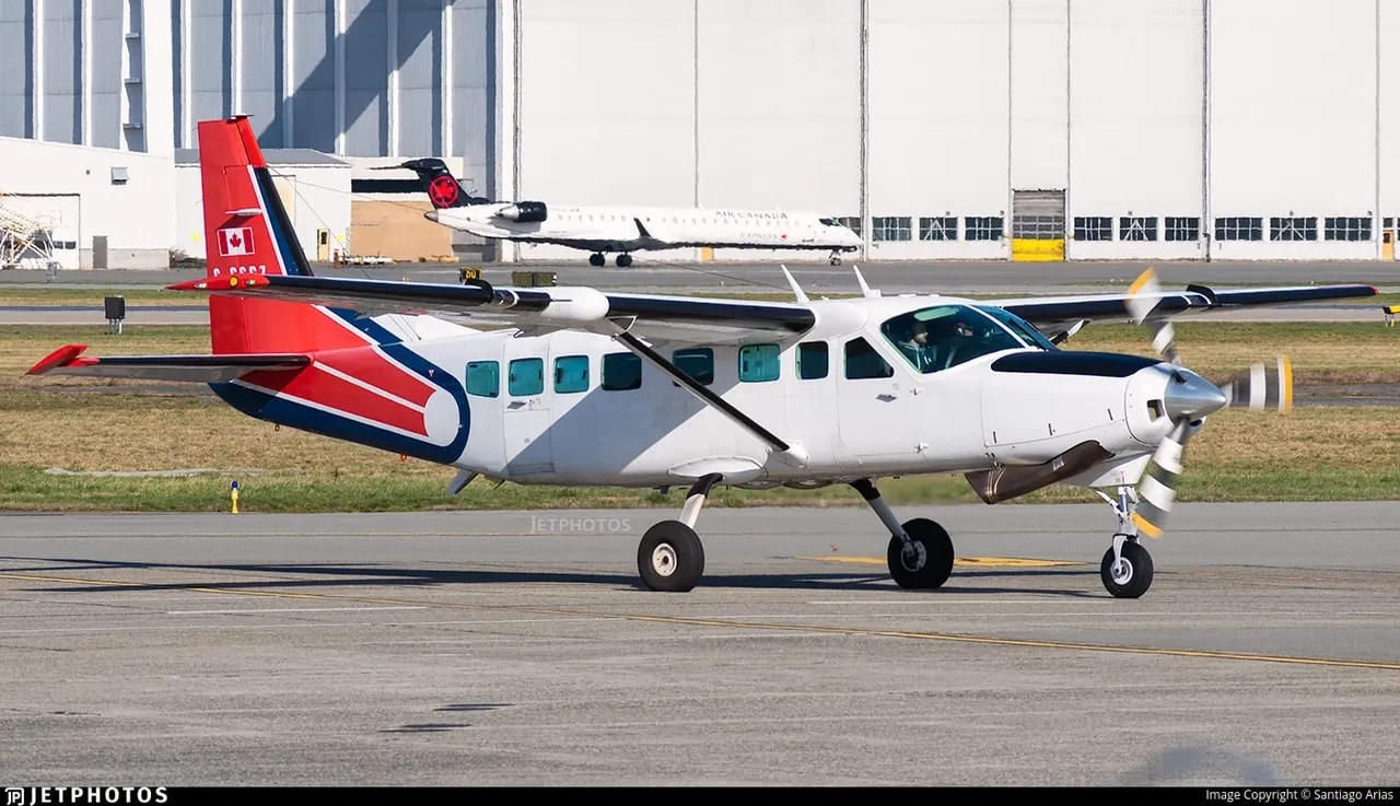 A small plane is sitting on the runway.